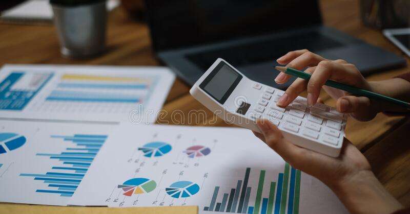 Close Up Business Woman Using Calculator And Laptop For Do Math Finance ...